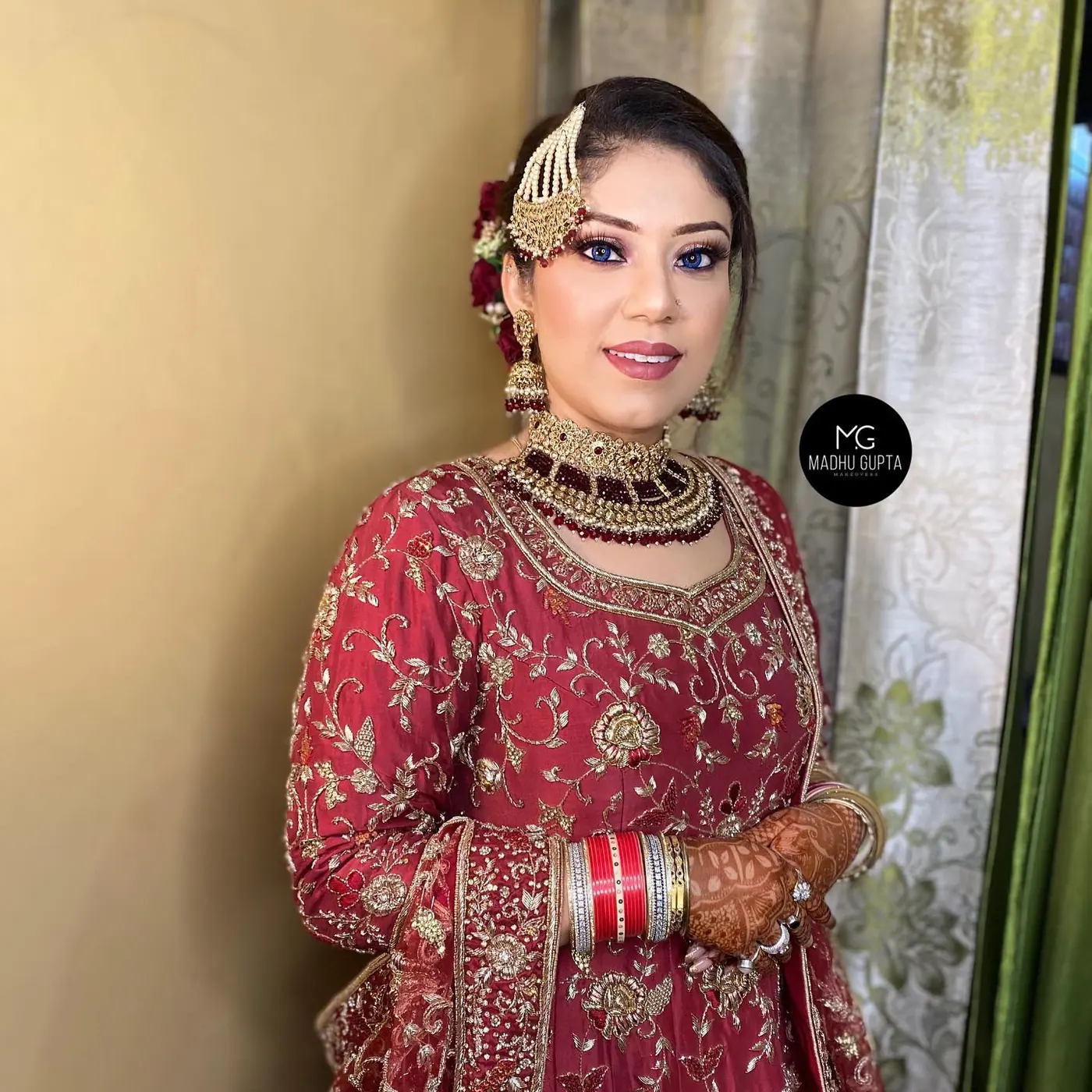 Floral Hair Accessory, Red Blouse. Bridal makeup by Madhu Gupta at MG Makeovers, Gurugram